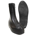 Side profile of the Original German Army rubber overshoe boot next to its flat textured non-slip sole