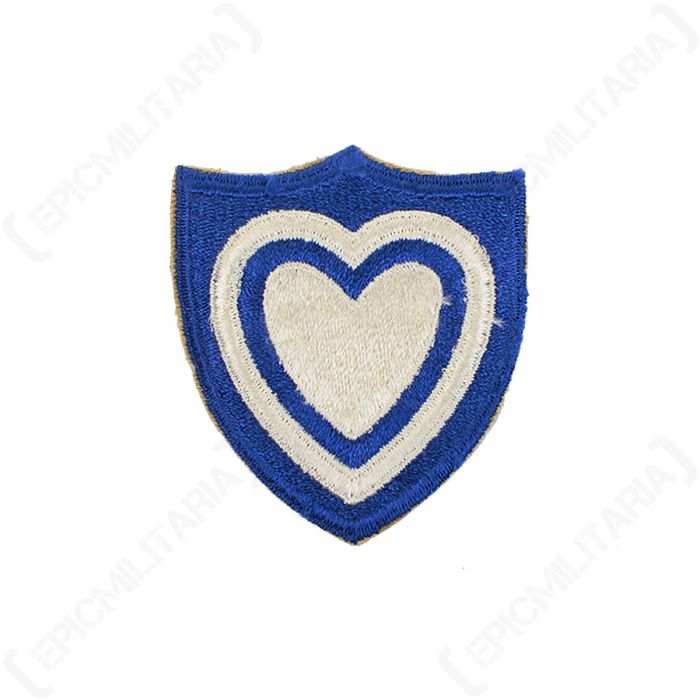Front view of original US XXIV Corps embroidered shield patch featuring white heart on blue background