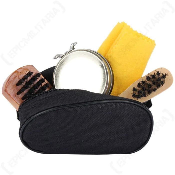 Clear shoe polish set in black canvas case with wooden brushes, yellow cloth, and metal polish tin