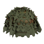 Original French Salade camouflage helmet cover fitted on green woodland side