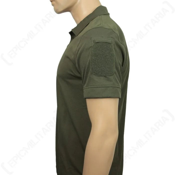 Close-up of the olive green tactical polo shoulder displaying the hook-and-loop morale patch panel.
