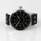 Angled three-quarter perspective of the WW2 Luftwaffe observer watch resting on a reflective surface