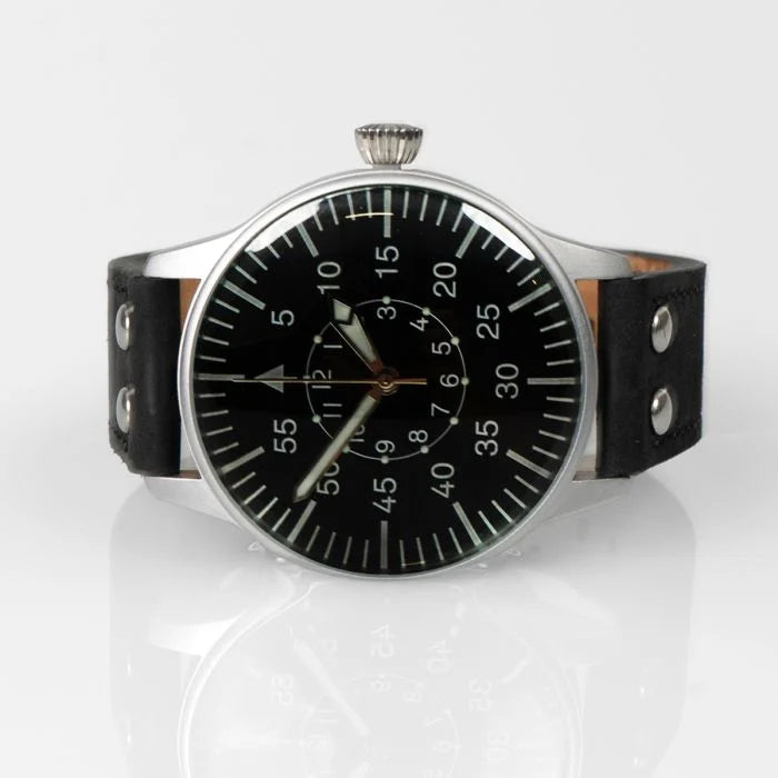 Angled three-quarter perspective of the WW2 Luftwaffe observer watch resting on a reflective surface