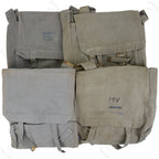 Four 1950s British 37 Pattern Large Packs in RAF grey, highlighting unique stains, wear, and handwritten identification marks.