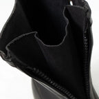 Interior view of the opened front zipper on the German military overboot showing the integrated waterproof gusset