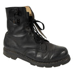 Side profile of a single black leather Austrian M75 double buckle combat boot.