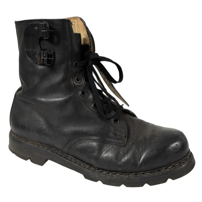 Side profile of a single black leather Austrian M75 double buckle combat boot.