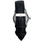 Rear close-up of the black pebbled wrist strap with silver-toned buckle and retention loops