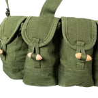 Close-up of the individual canvas pouches with wooden toggle fasteners on the SKS chest rig