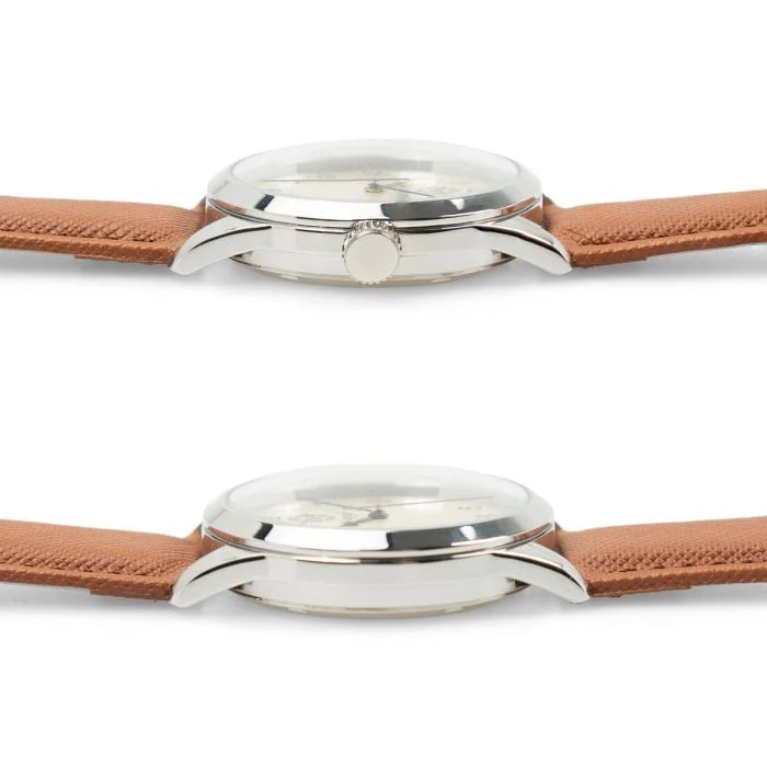 Direct side profile showing crown, bezel height, and slim case design