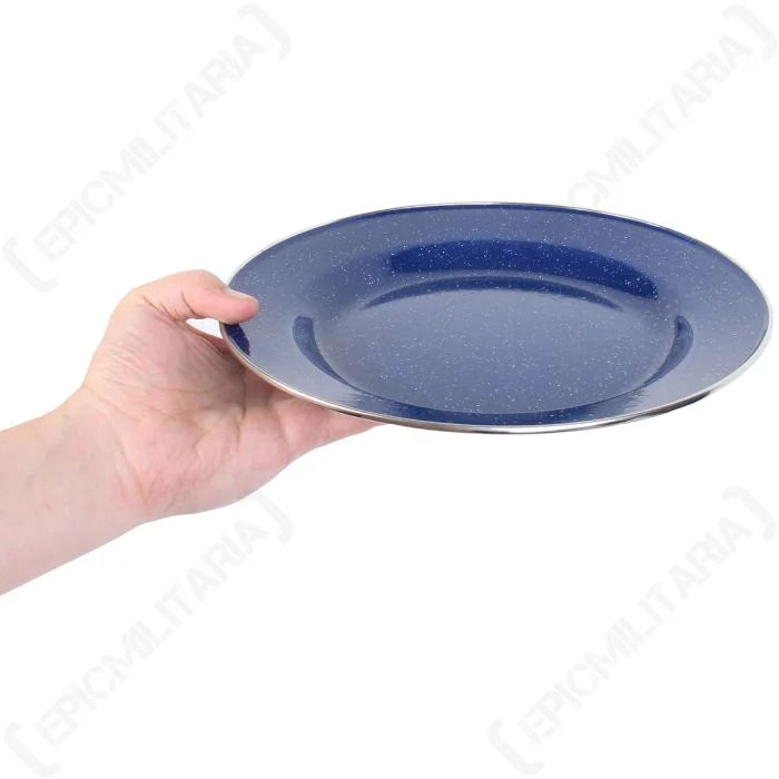 Blue enamel dinner plate held in hand showing full diameter and glossy finish.