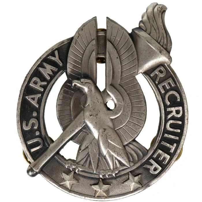 Front view of original silver US Army Recruiter Badge featuring eagle and torch emblem