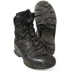 Front and sole view of the German Army Haix combat boots showing the black leather uppers and the Vibram sole tread pattern.