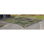 Czech Army camouflage net laid out flat on asphalt showing square grid pattern