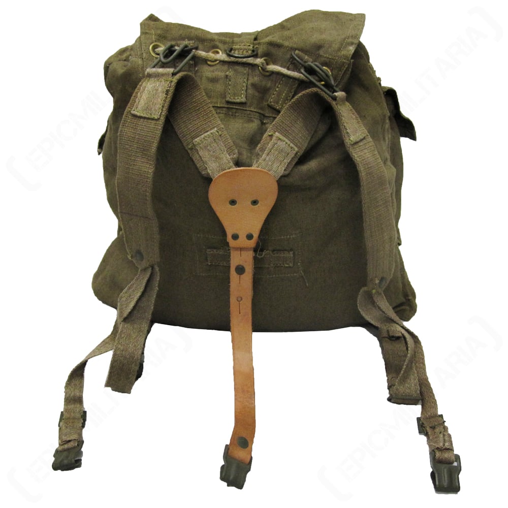 Rear view of a vintage Czech M60 rucksack featuring the original adjustable canvas and leather Y-strap harness system for load-bearing stability.