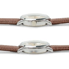 Side profile showing the domed crystal, slim polished case, and adjustment crown
