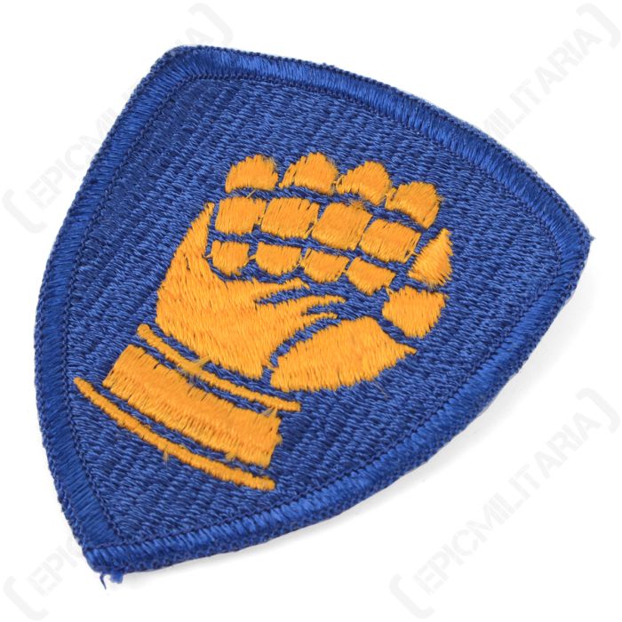 Side profile of the embroidered 46th Infantry Division patch showing thread texture and stitched border
