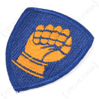 Side profile of the embroidered 46th Infantry Division patch showing thread texture and stitched border