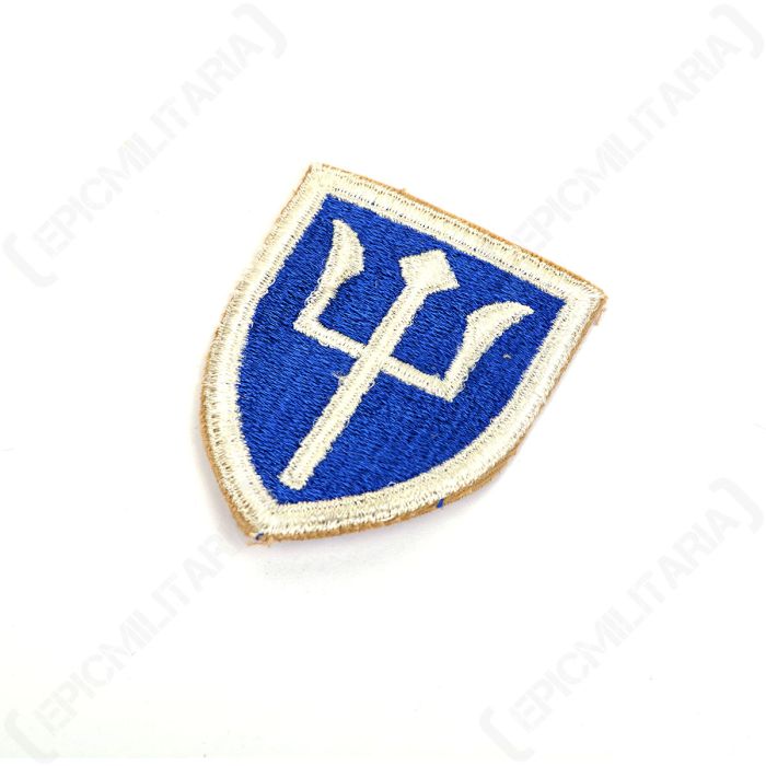 Angled view of original US 97th Infantry Division trident shoulder sleeve insignia