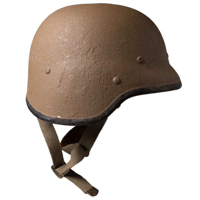 Side profile of South African M87 helmet showing rubber rim and chin strap