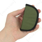Tactical sewing kit closed in olive green zippered nylon case held in hand