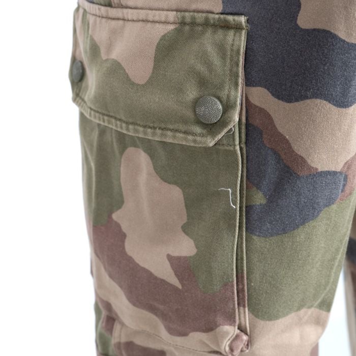 Close-up of the French Army F2 thigh cargo pocket with textured snap fastener