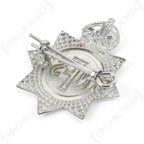 Angled rear view of WW2 British NFS cap badge highlighting die-cast metal detail and lug fastening