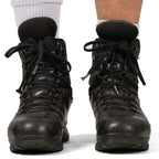 Front view of both Haix combat boots laced up and worn with white socks, showing the high-ankle support and laces.