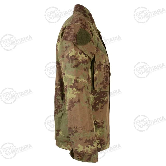 Side profile showing reinforced elbow patch and button cuff on Vegetato field shirt