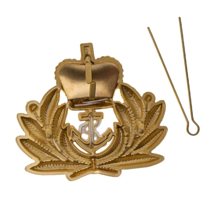 Back of unissued Royal Navy Officer cap badge with steel split hairpin cotter pin removed from horizontal lugs