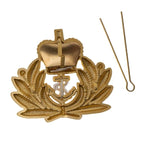 Back of unissued Royal Navy Officer cap badge with steel split hairpin cotter pin removed from horizontal lugs