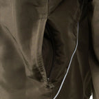 Zoomed view of the secure zippered side hand-warmer pocket with reflective piping details on the Austrian Army training top.