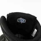 Close-up of the interior tongue label of the Haix combat boot showing the blue and white embroidered HAIX logo.