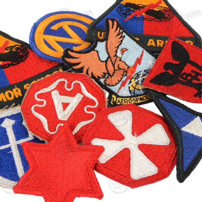 Close up view of original post WW2 US Army embroidered unit patches including Armor School