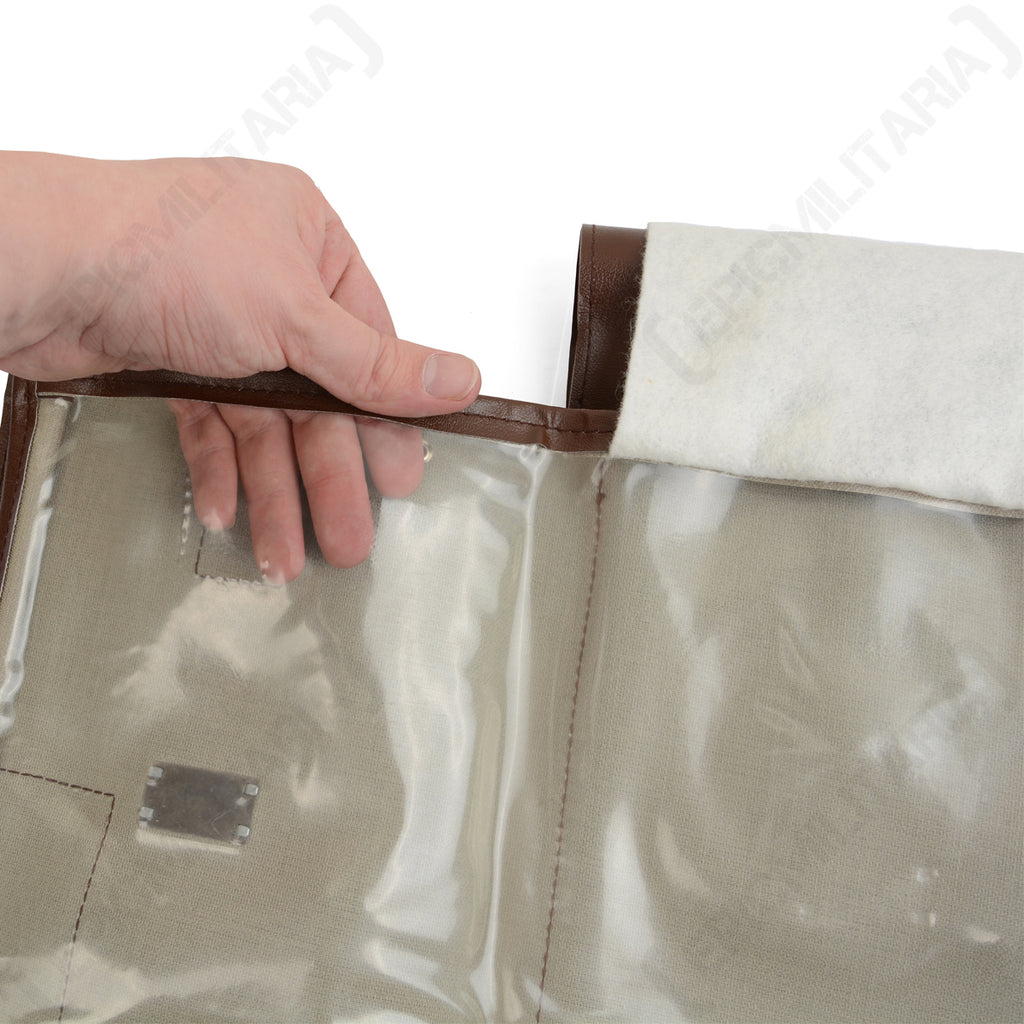 Close-up of a hand opening the clear plastic internal sleeve of the map holder, showing the durable construction for map display.