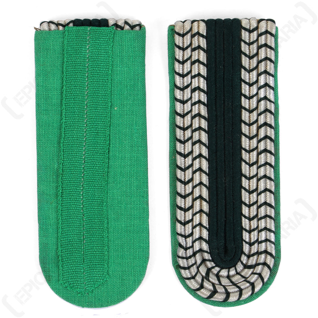 Reverse side view showing the light green cotton fabric and mounting loop of the unissued East German border police shoulder boards next to the braided front.