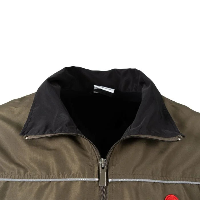 Close-up view of the stand-up collar and front zip pull on the Austrian Army Sportanzug 03 jacket.