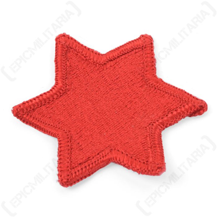 Close-up view showing embroidered thread texture and stitched border of US 6th Infantry patch