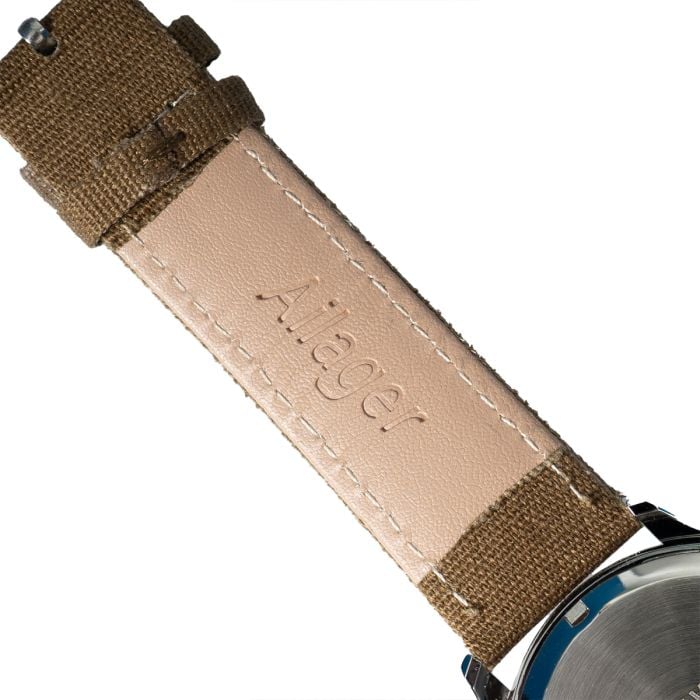 Underside detail of the brown canvas strap showing the beige PU leather lining and Ailager logo