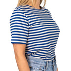 Side profile view of female model wearing striped Russian Telnyashka short sleeve t-shirt
