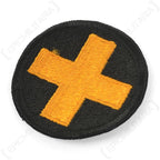 Side angle view of US 33rd Infantry Division Golden Cross shoulder patch