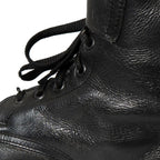 Close-up detail of the textured full-grain black cowhide leather on an Austrian combat boot.