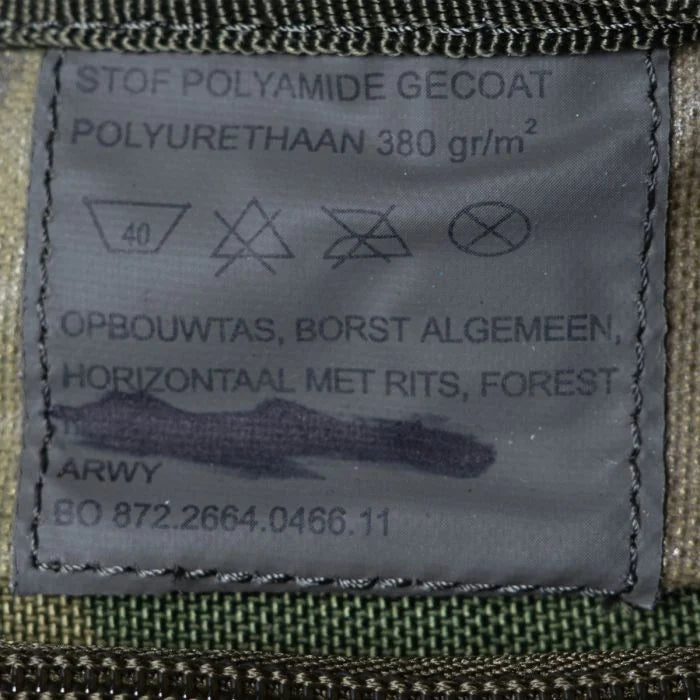 Inside military label of the Dutch chest pouch showing ARWY manufacturer name, polyurethane polyamide fabric details, and contract number