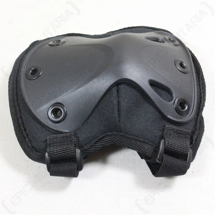 Close-up of thermoplastic rubber shell on black angled elbow pad