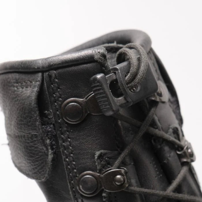 Close-up of the lace tensioner toggle and velcro lace pocket on the collar of German Meindl flight boots