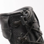 Close-up of the lace tensioner toggle and velcro lace pocket on the collar of German Meindl flight boots