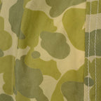 Detail view of frogskin green spot camouflage print and parachute seam stitching