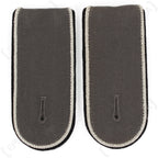 Pair of dark grey wool German Bundeswehr officer shoulder boards with braided edge piping and integrated tunic attachment tabs.