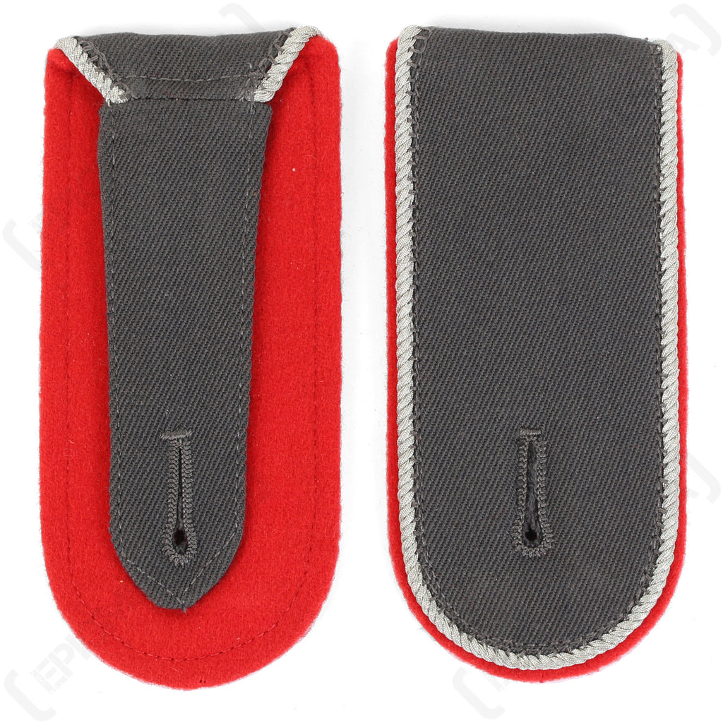 Genuine Bundeswehr shoulder boards in red artillery branch color, showing the wool construction and buttonhole attachment design.