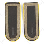 Pair of authentic German Bundeswehr Stabsunteroffizier shoulder boards with yellow piping and grey fabric.